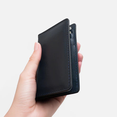 Modish Carry Unisex Bi-Fold Blue Card Holder held in hand pocket-friendly vegan leather accessory